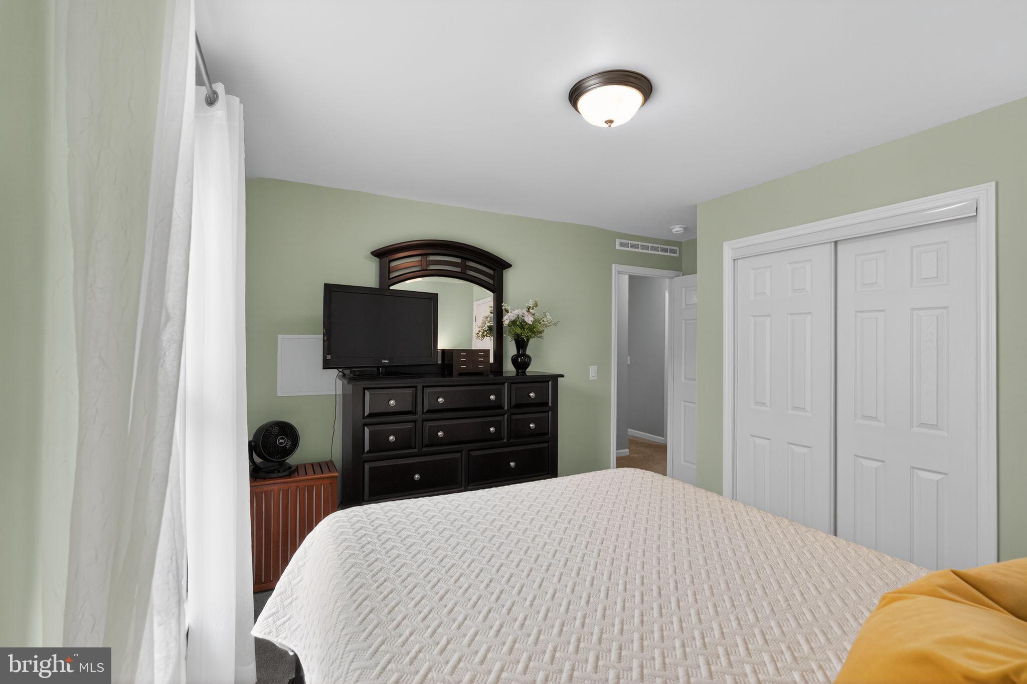 411 Honeysuckle Lane Blue Bell, PA 19422 - Photo 22 of 26 a bedroom with a bed and a television