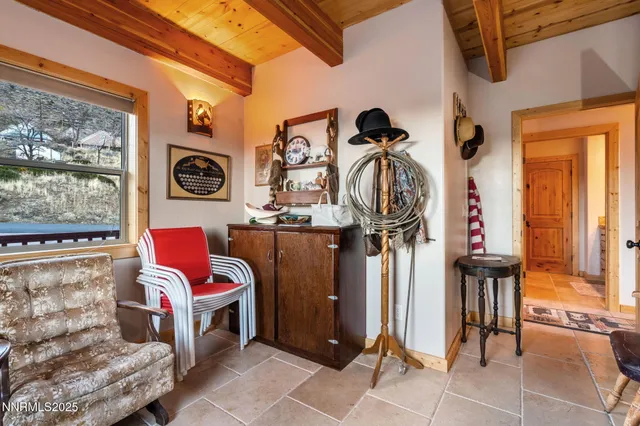 a bedroom with furniture and a window