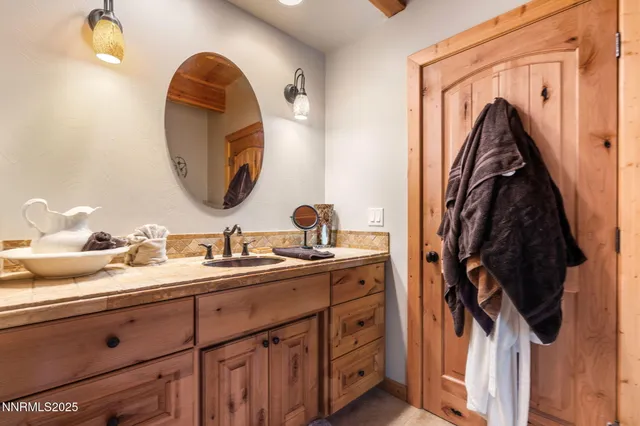 a en suite bathroom with a sink and mirror