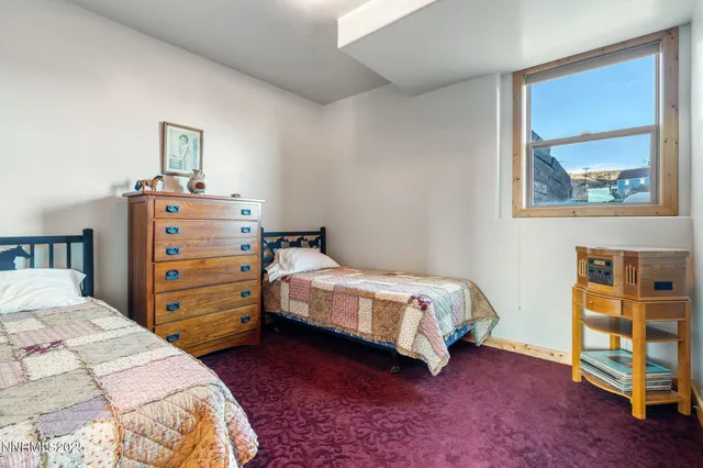 a bedroom with a bed and a cabinets