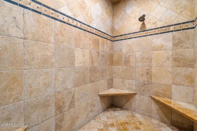 a bathroom with a bathtub and shower