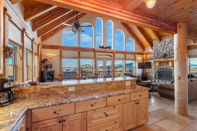 a view of a living room and entry way to building