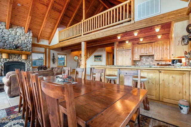 a dining table with chairs and wooden floor