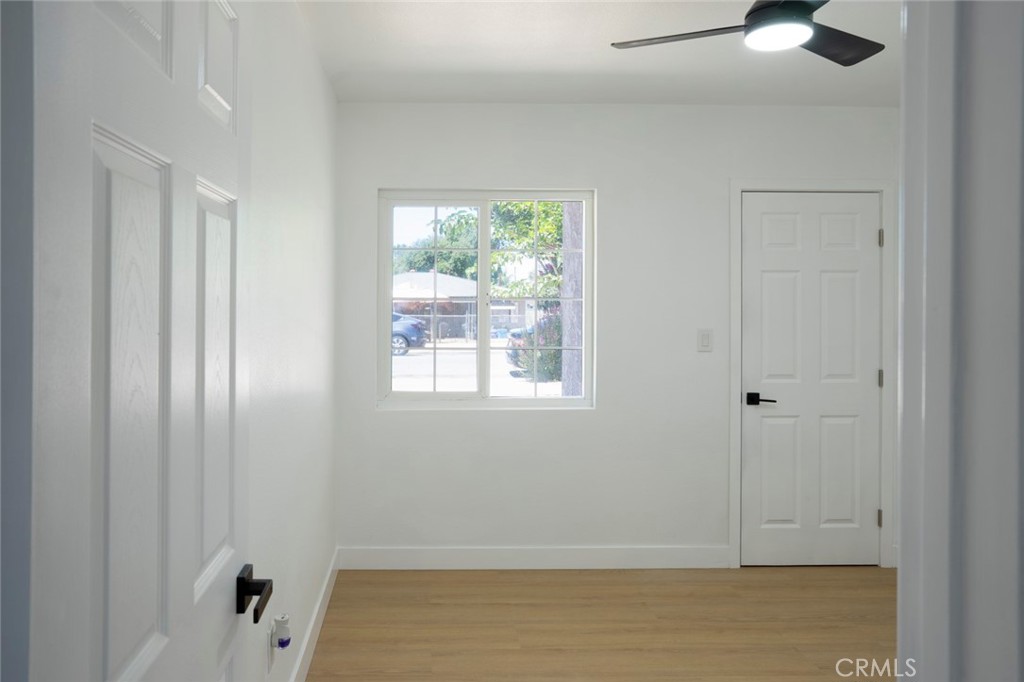 1218 6th Street Redlands, CA 92374 - Photo 10 of 16 a view of an empty room with window and cabinet area