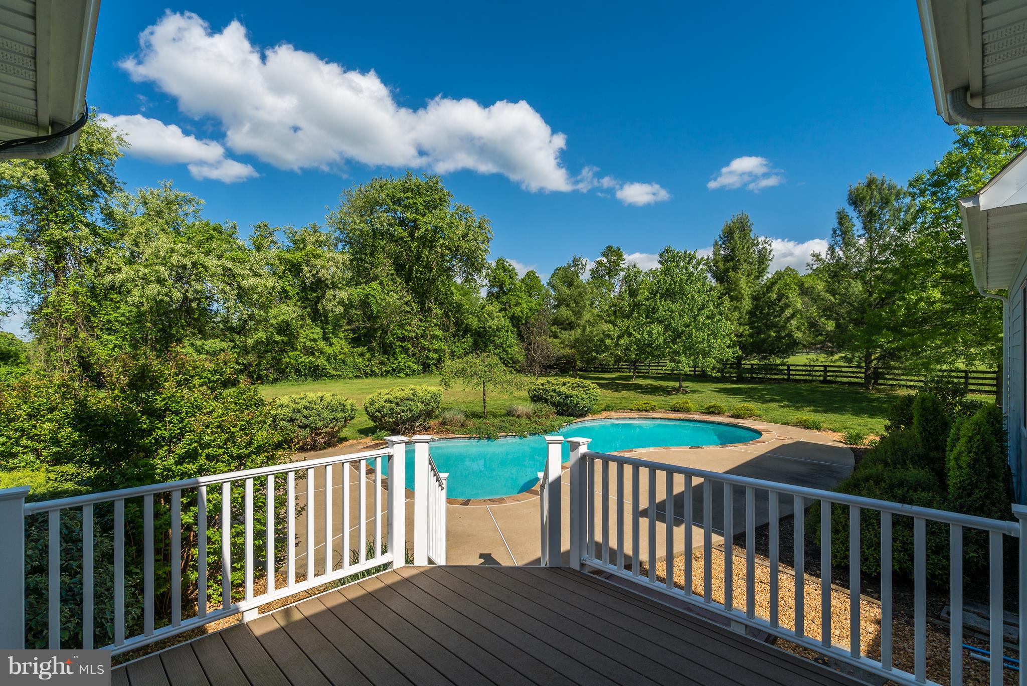 20393 Cockerill Road Purcellville, VA 20132 - Photo 13 of 29 trex deck leading to pool