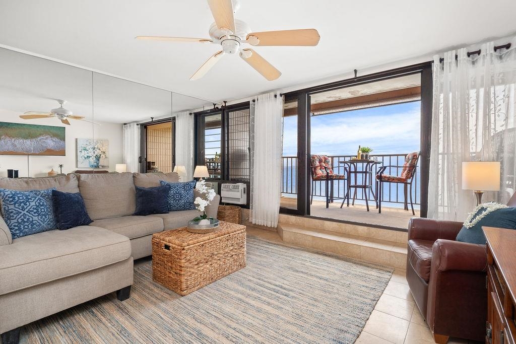3785 Lower Honoapiilani Road, Unit 208 Lahaina, HI 96761 - Photo 19 of 50 a living room with furniture and a large window