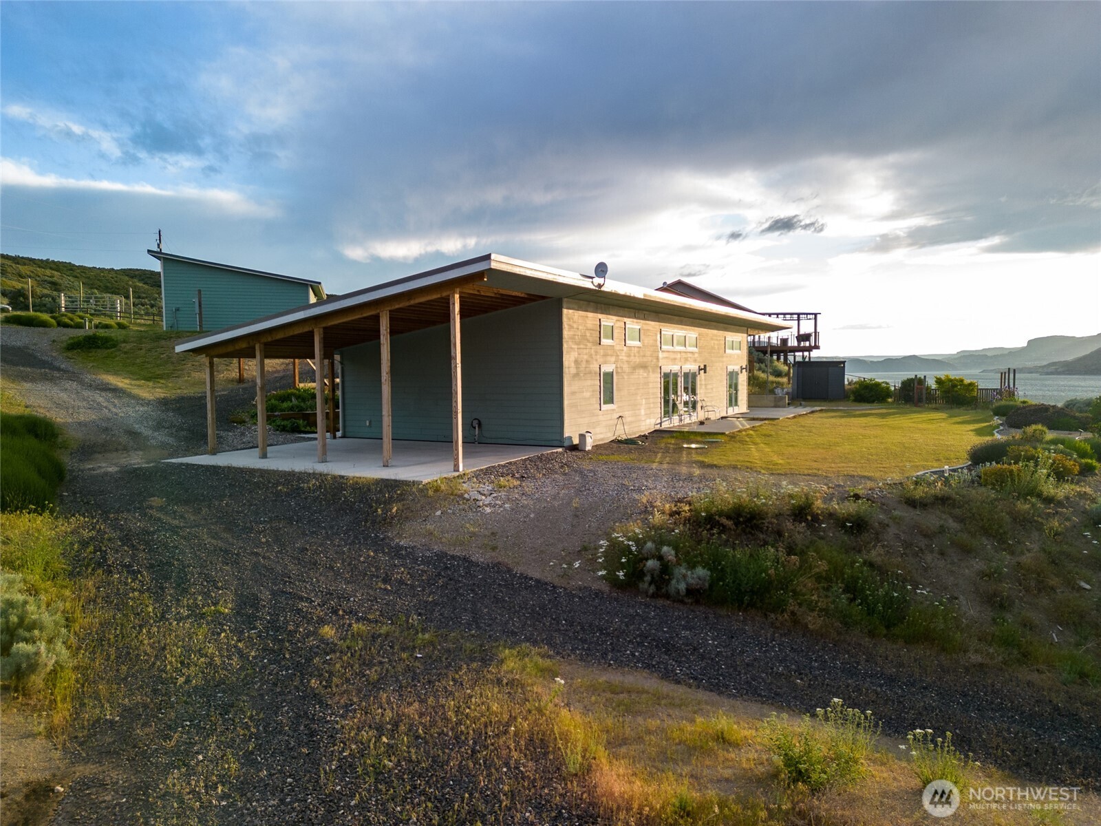 4205 Plum Point Road Grand Coulee, WA 99133 - Photo 33 of 39 a view of a house with backyard and sitting area