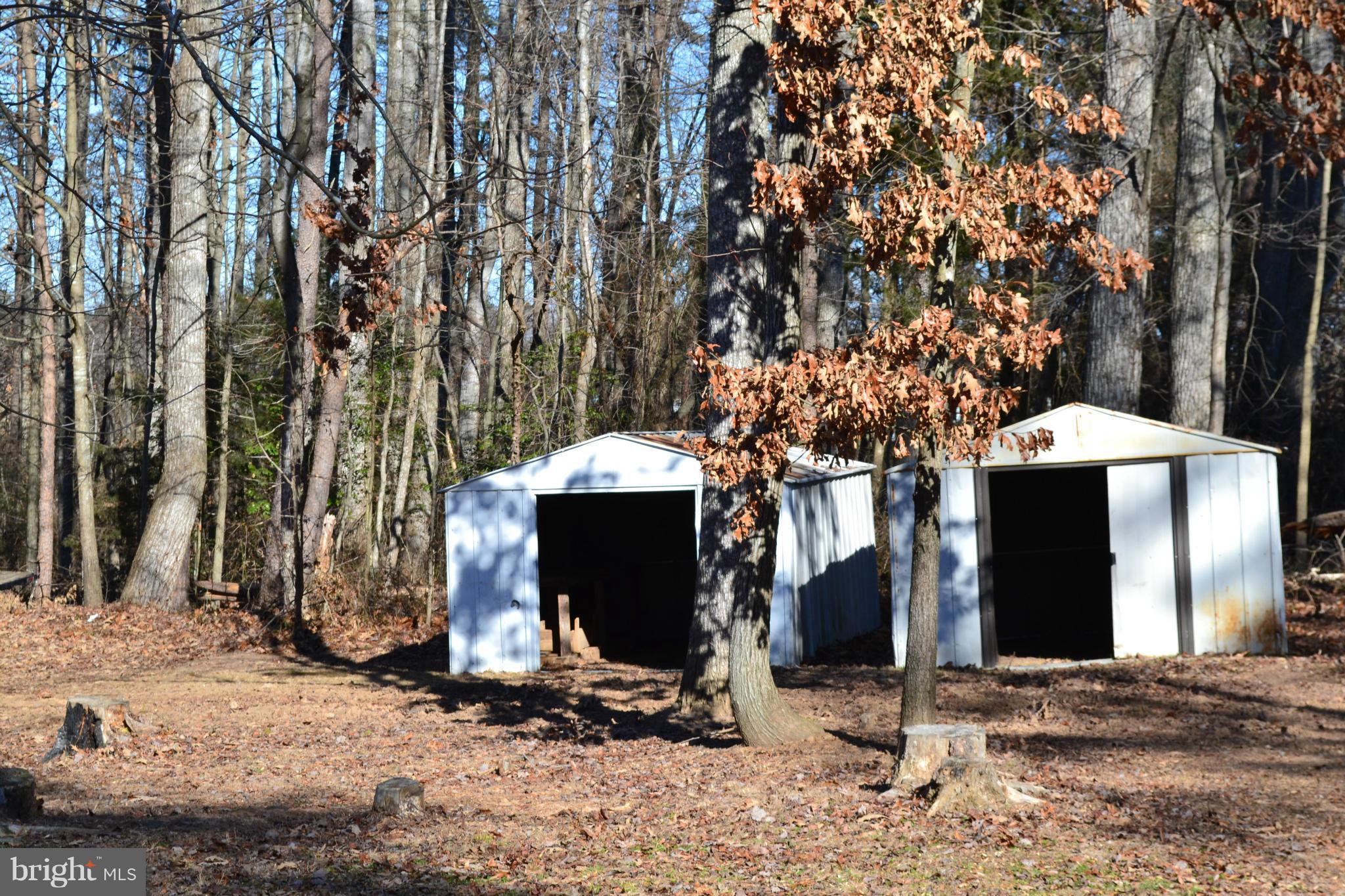 3232 Winding Road Partlow, VA 22534 - Photo 2 of 8 a backyard of a house with barbeque oven fire pit table and chairs
