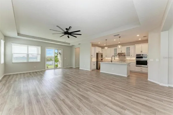 a view of kitchen with cabinets and wooden floor