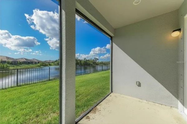 a view of a backyard with a lake view
