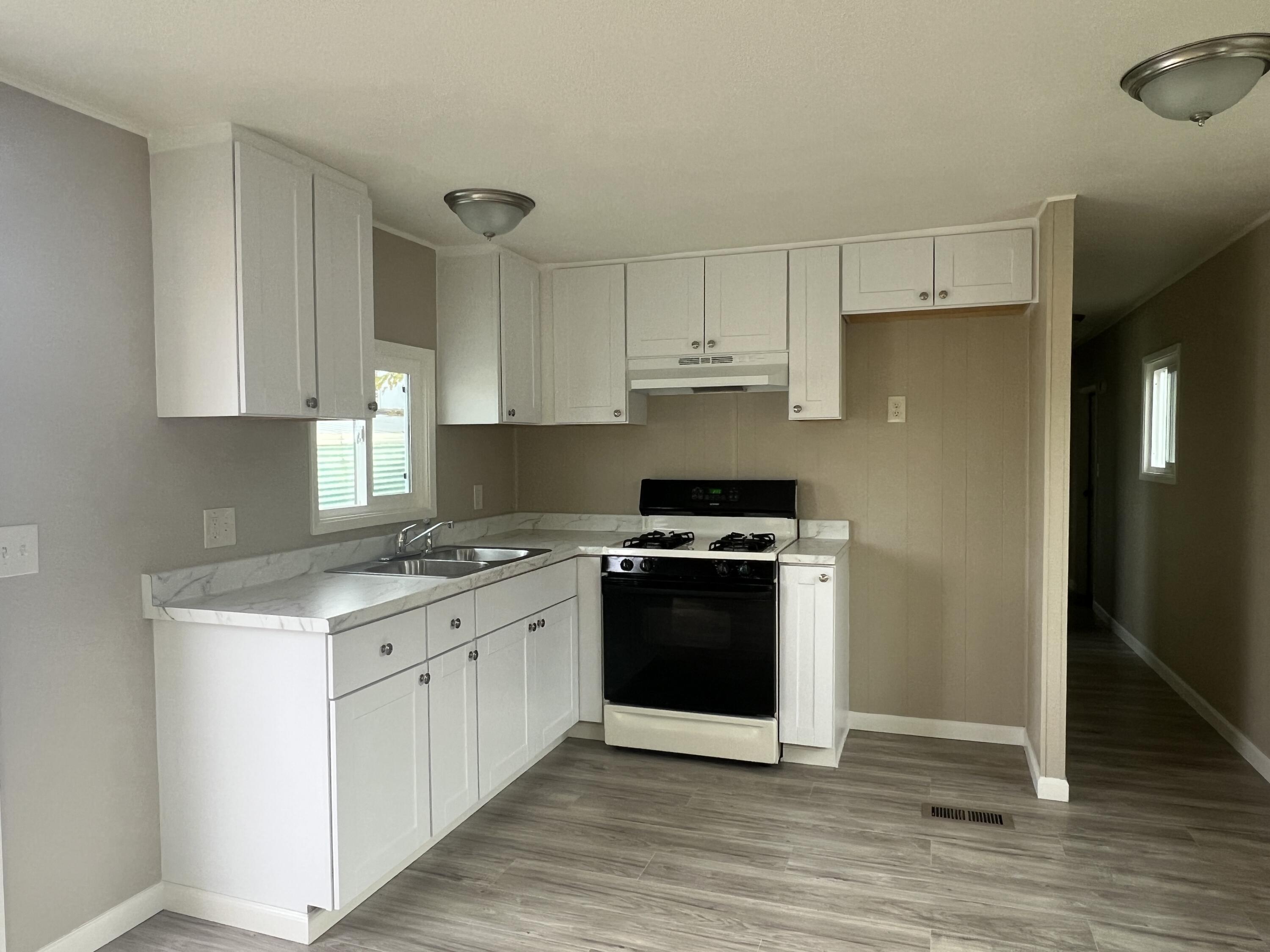 481 Twin View Boulevard, Unit 97 Redding, CA 96003 - Photo 2 of 13 a kitchen with stainless steel appliances a sink stove and refrigerator