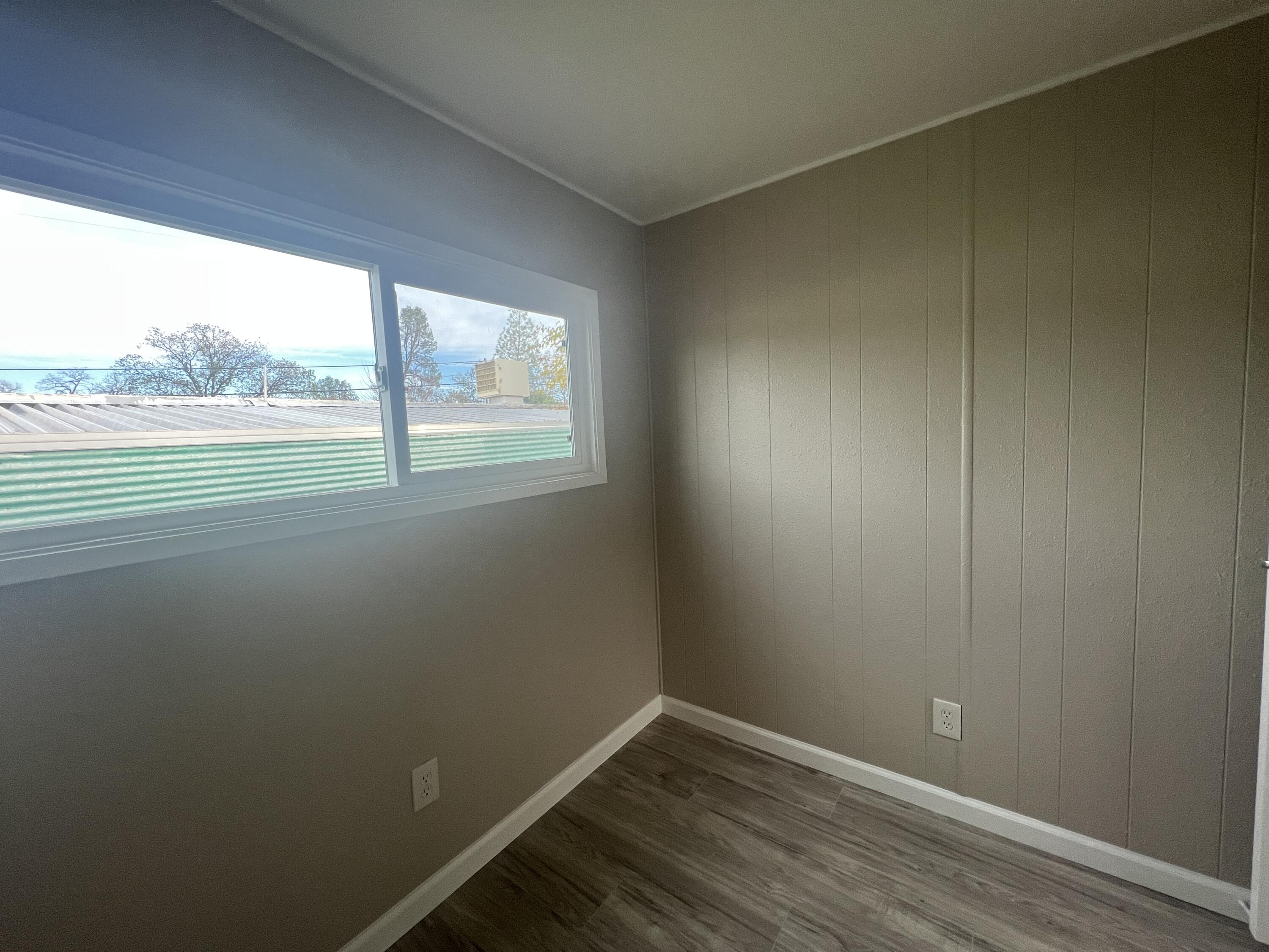 481 Twin View Boulevard, Unit 97 Redding, CA 96003 - Photo 6 of 13 a view of an empty room with a window