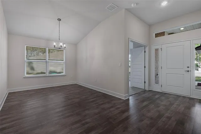 a large kitchen with stainless steel appliances granite countertop a large stove a sink and a refrigerator