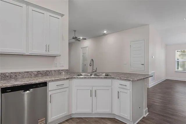 a view of kitchen with wooden floor and window
