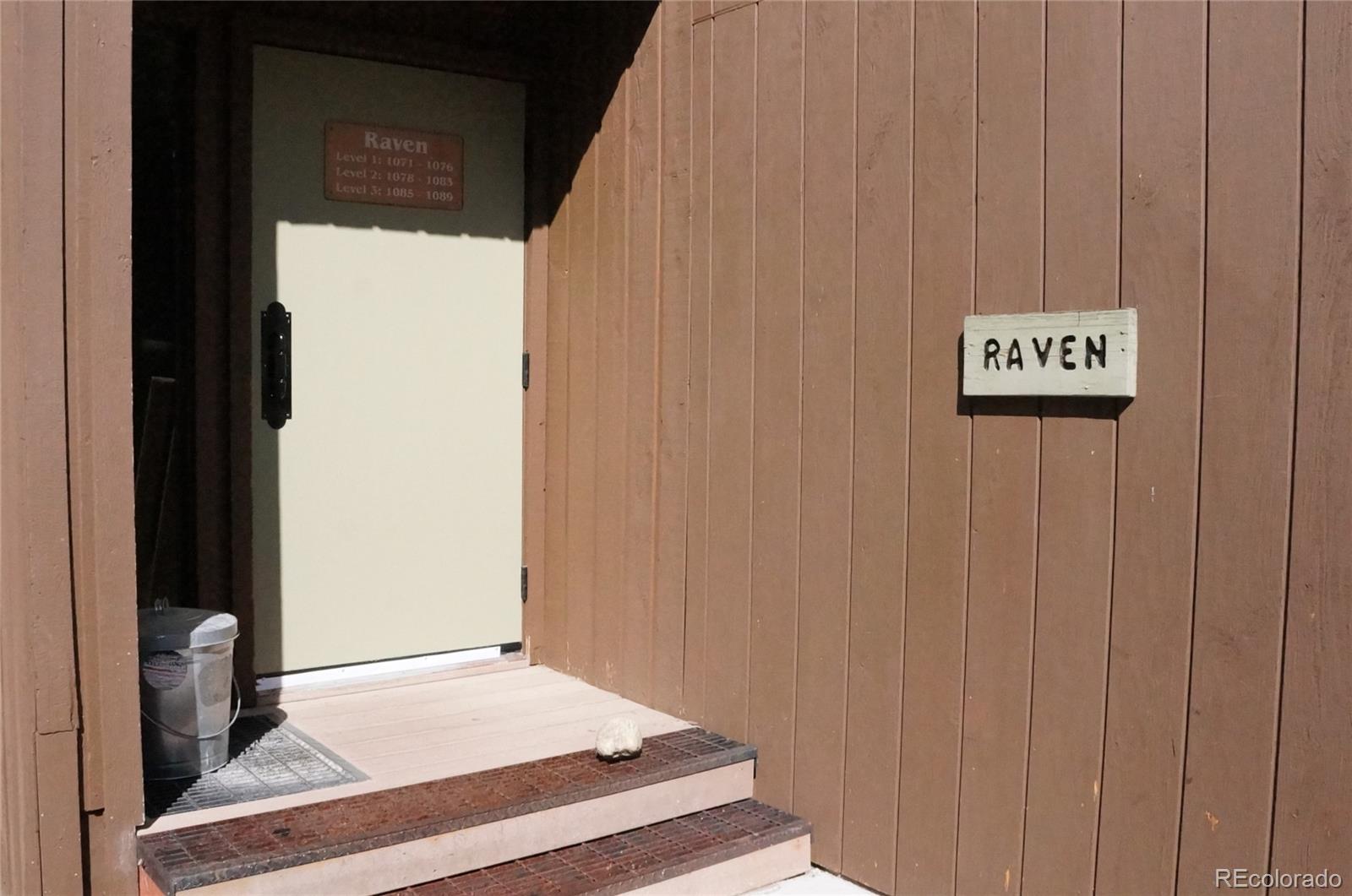 373 Wild Irishman Road, Unit 1071 Dillon, CO 80435 - Photo 3 of 19 a view of a hallway with wooden floor and a cabinet
