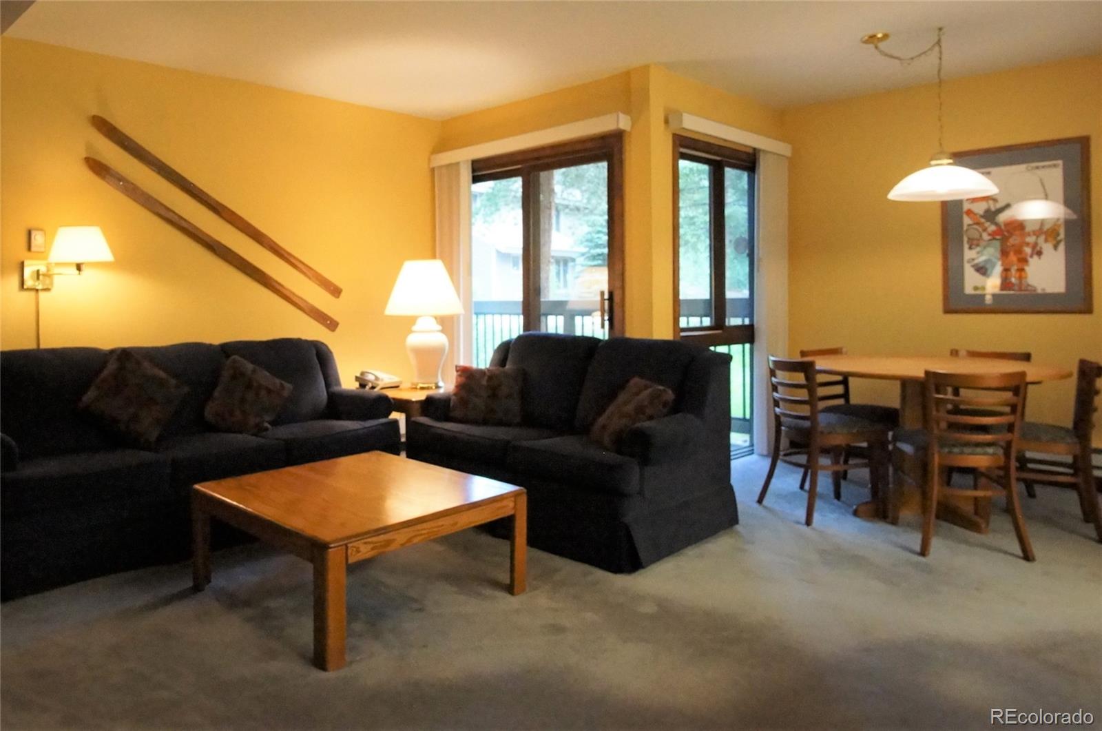 373 Wild Irishman Road, Unit 1071 Dillon, CO 80435 - Photo 4 of 19 a living room with furniture and a large window