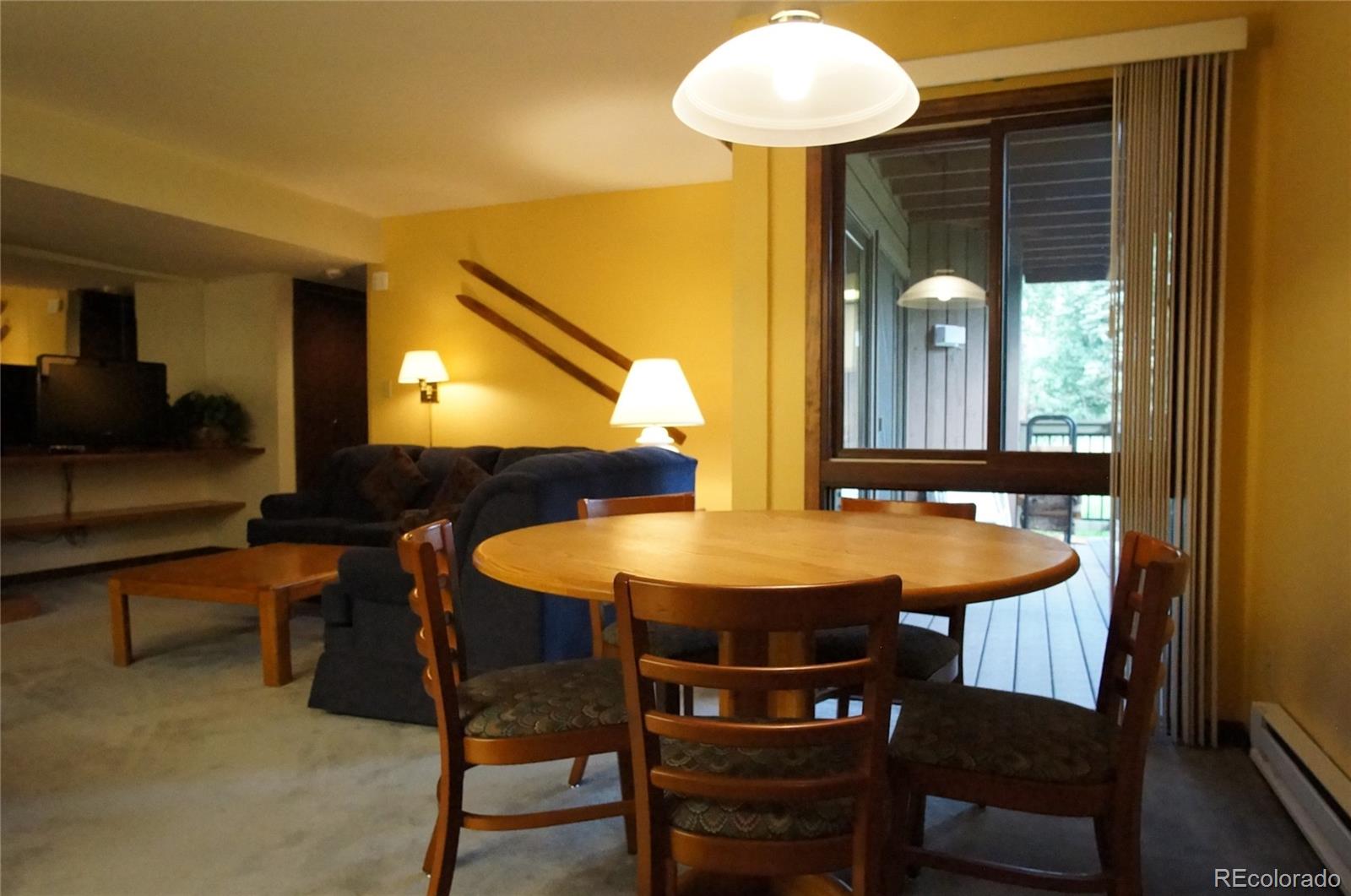 373 Wild Irishman Road, Unit 1071 Dillon, CO 80435 - Photo 5 of 19 a view of a dining room with furniture and chandelier