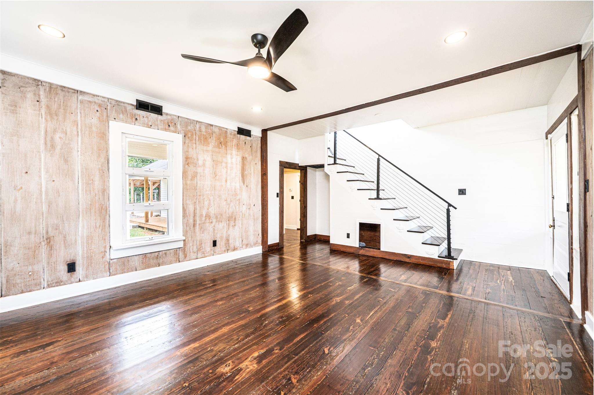 4645 Rifle Range Road Conover, NC 28613 - Photo 16 of 36 a view of empty room with wooden floor and fan
