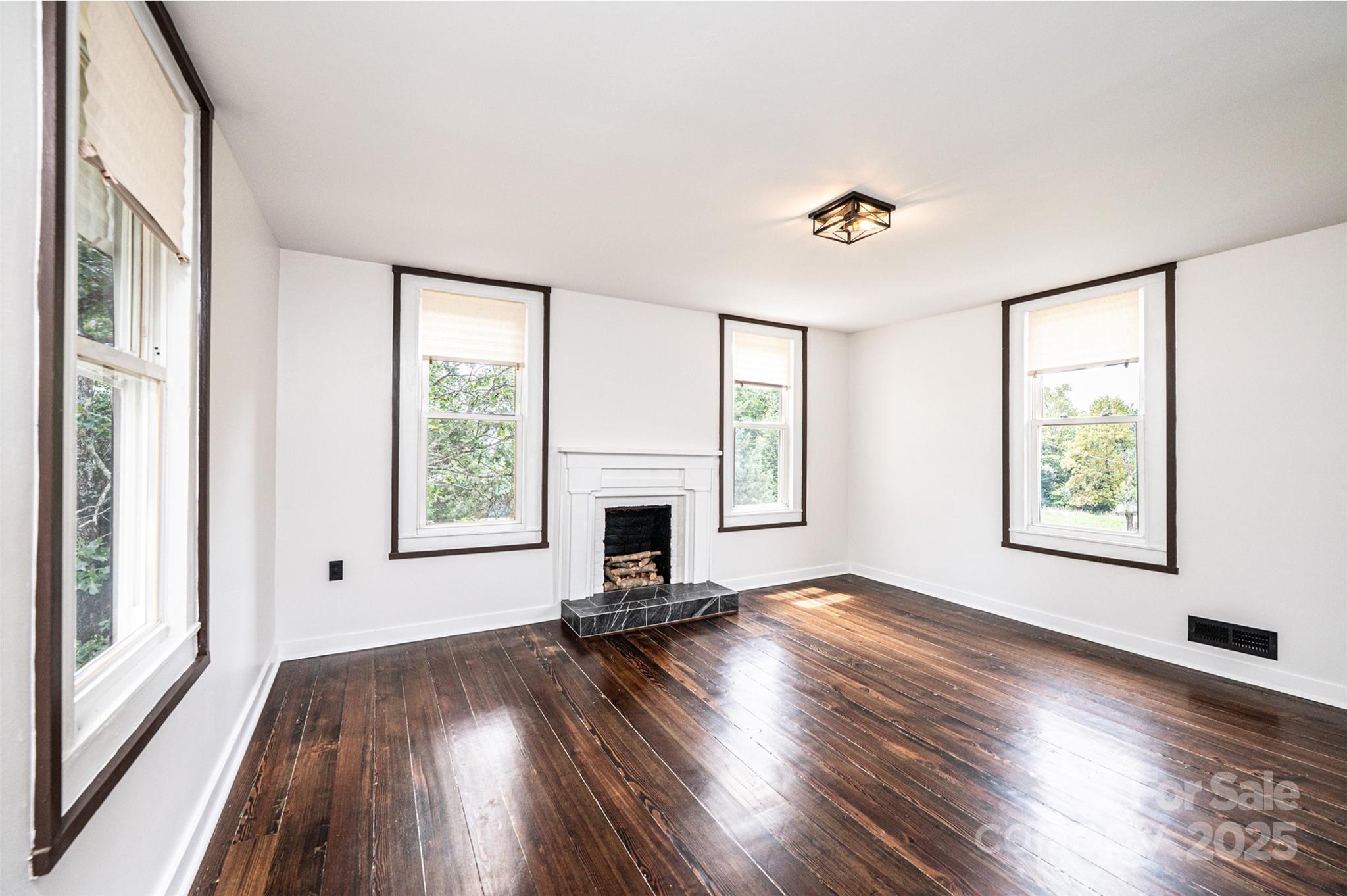 4645 Rifle Range Road Conover, NC 28613 - Photo 26 of 36 wooden floor in an empty room with a window