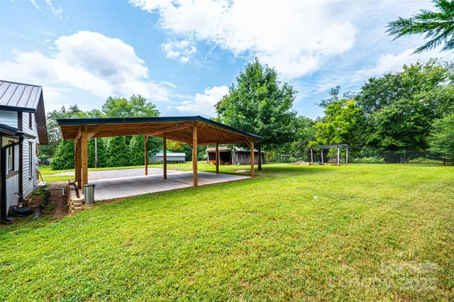 a swimming pool with some trees in the background