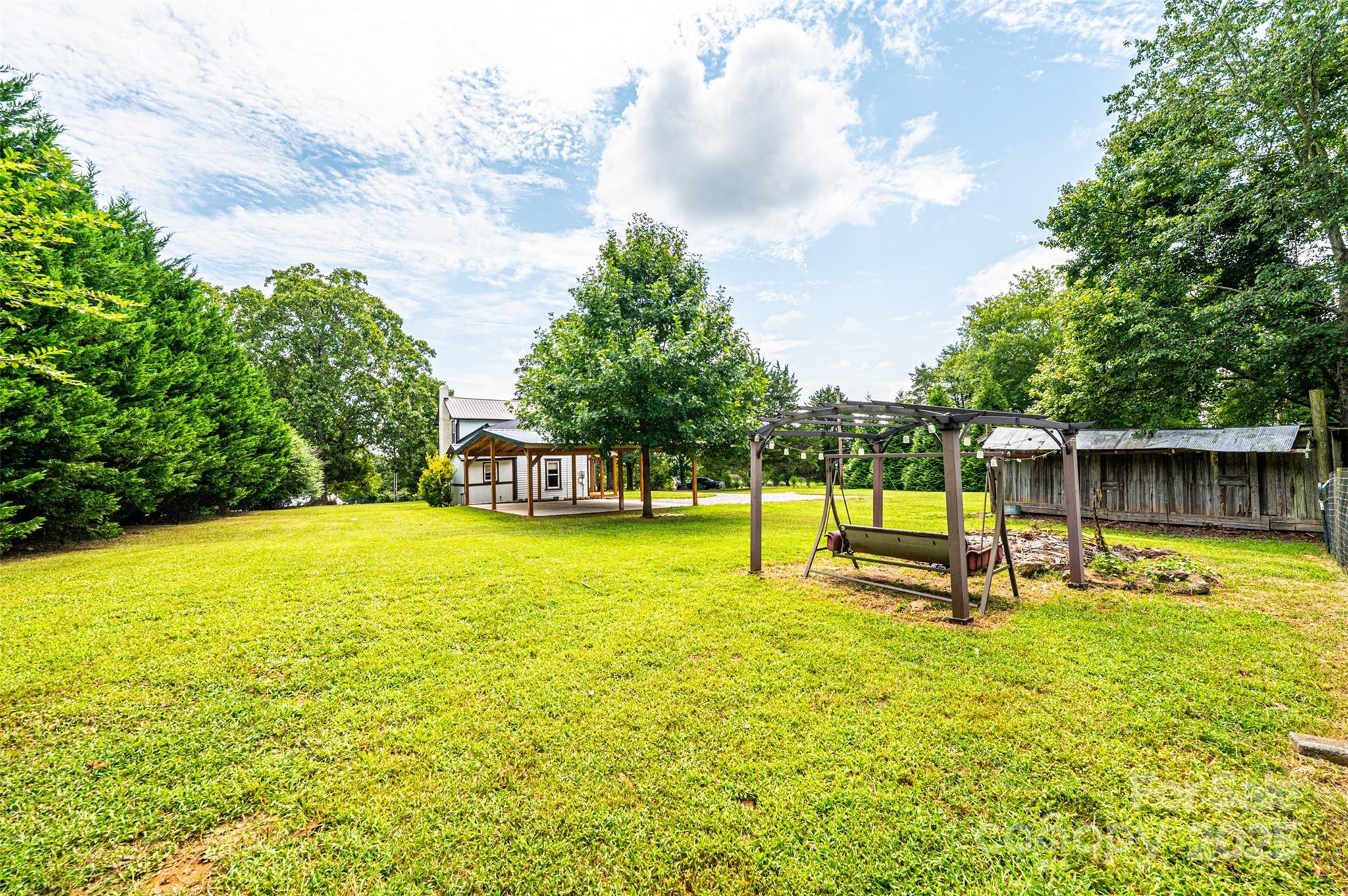 4645 Rifle Range Road Conover, NC 28613 - Photo 36 of 36 a swimming pool with some trees in the background