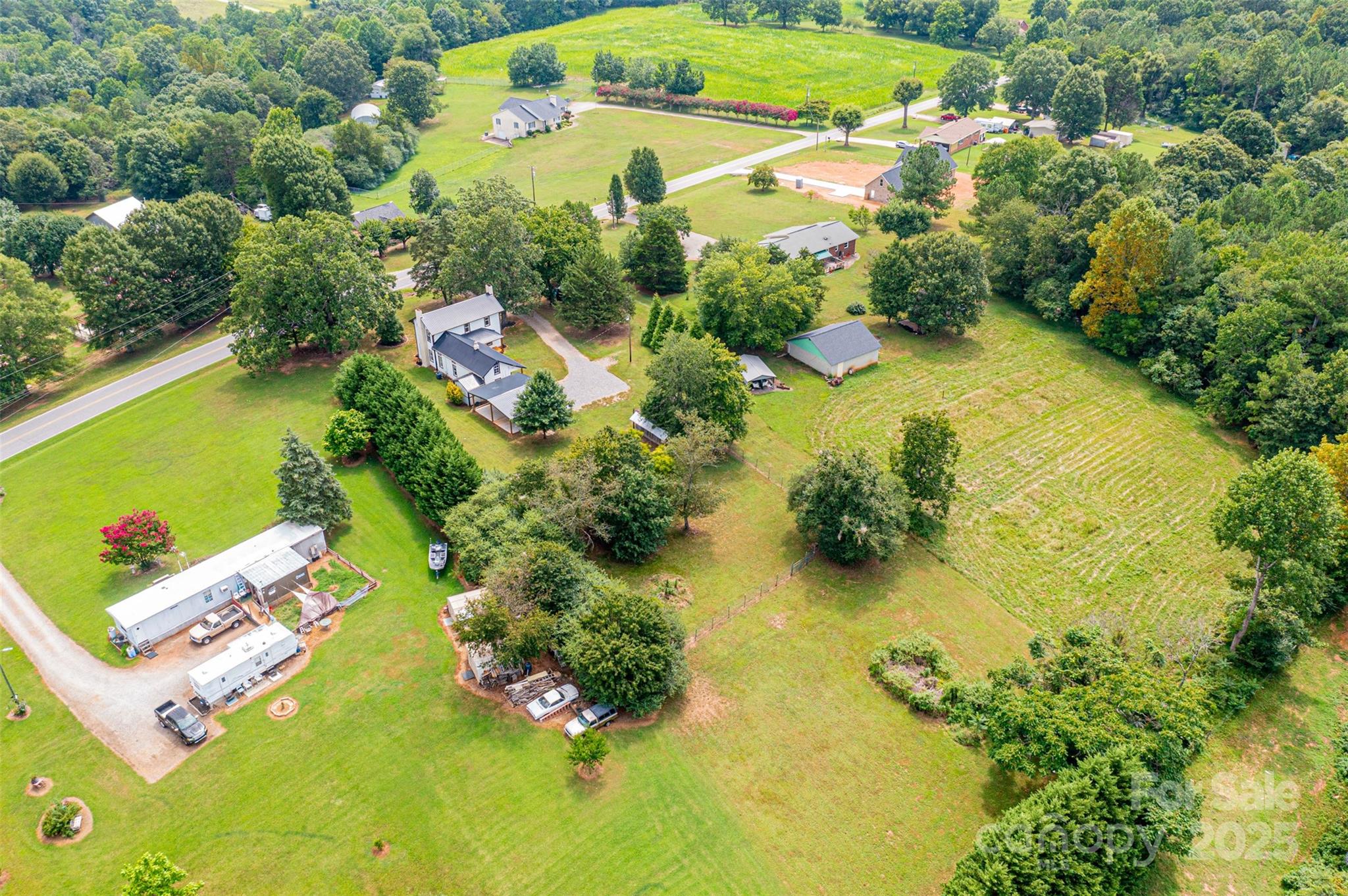 4645 Rifle Range Road Conover, NC 28613 - Photo 4 of 36 an aerial view of residential house with swimming pool and garden