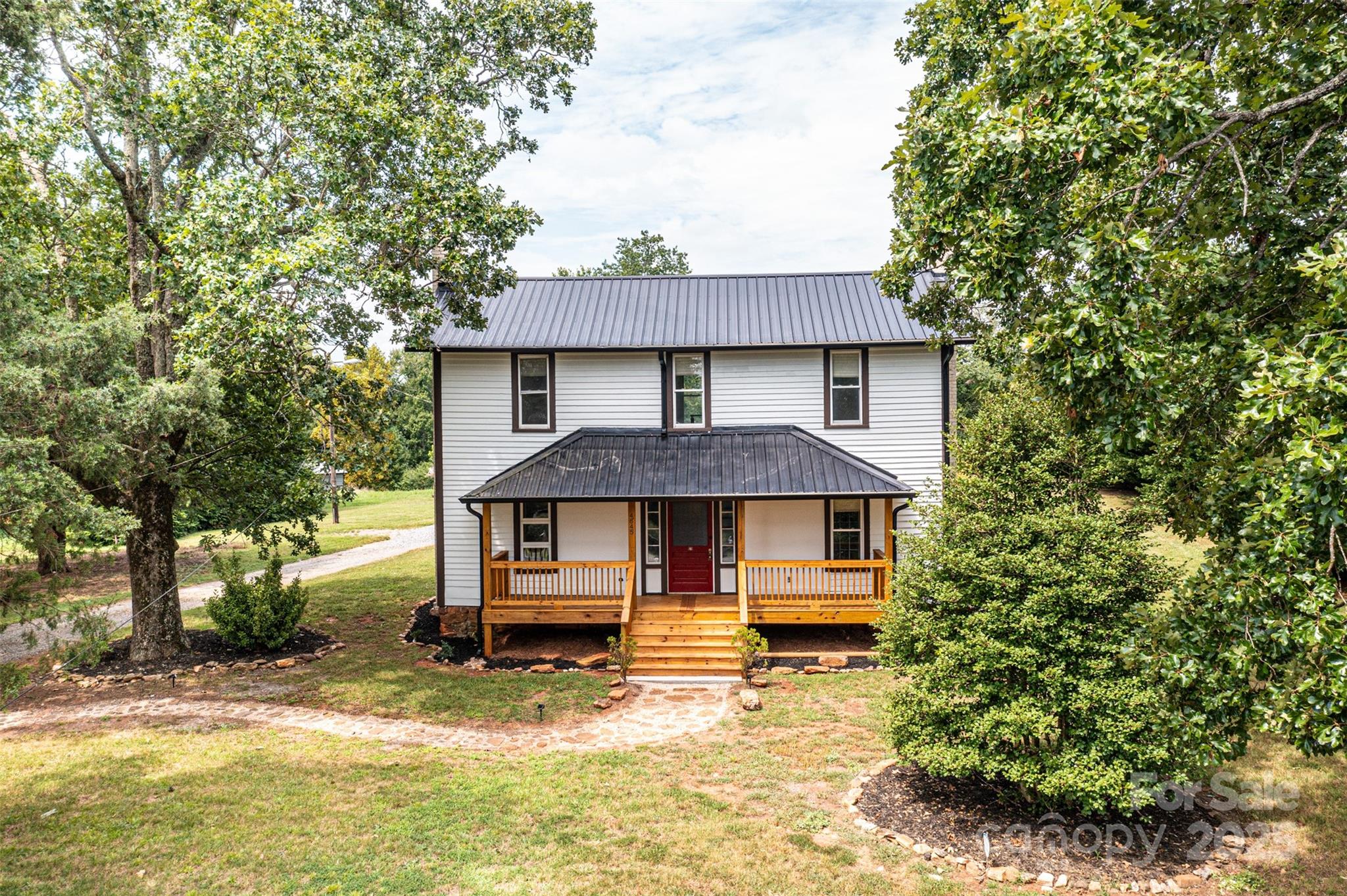 4645 Rifle Range Road Conover, NC 28613 - Photo 6 of 36 a front view of a house with a yard