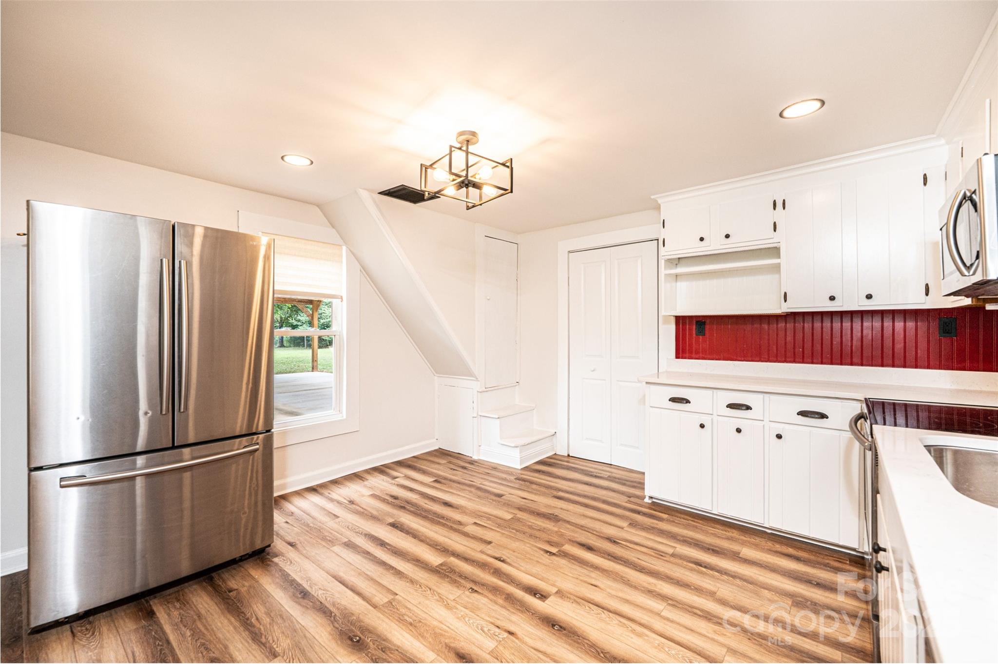 4645 Rifle Range Road Conover, NC 28613 - Photo 10 of 36 a kitchen with stainless steel appliances a refrigerator sink and cabinets