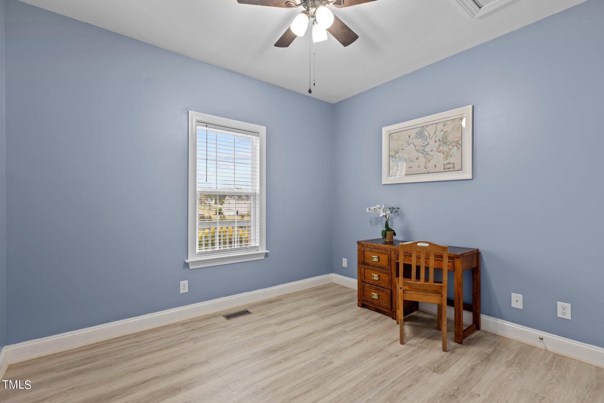 148 Ina Joe Place Willow Spring, NC 27592 - Photo 17 of 41 a living room with furniture and a window