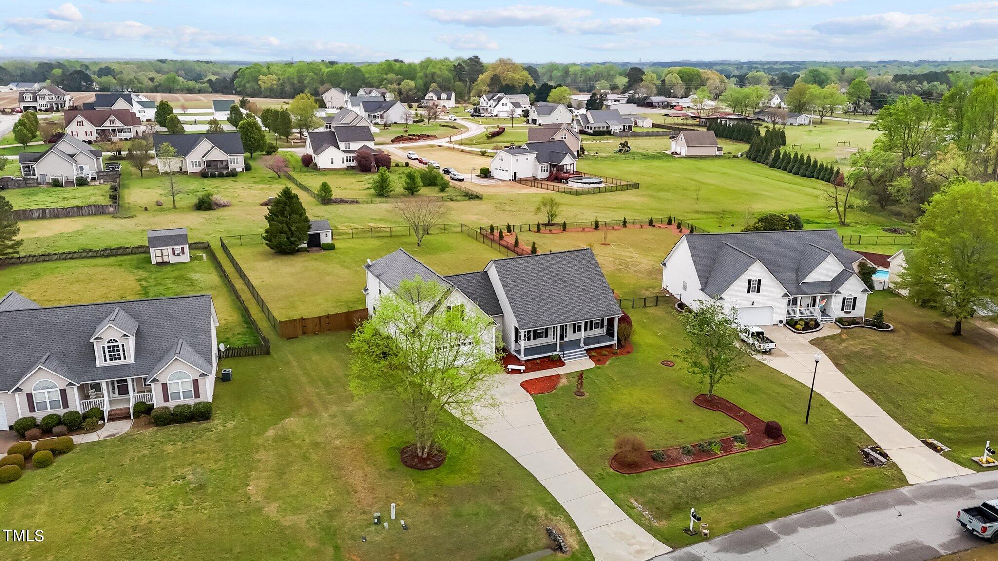 148 Ina Joe Place Willow Spring, NC 27592 - Photo 39 of 41 an aerial view of a house with a swimming pool yard and outdoor seating