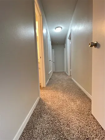 an empty room with a bathroom