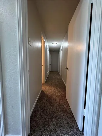 a view of a hallway to other door