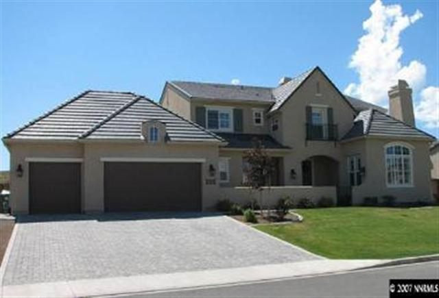 8310 Fairway Ridge Court Reno, NV 89523 - Photo 1 of 9 a front view of a house with a garden and yard