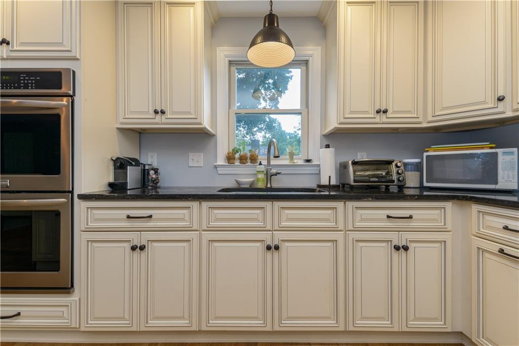 405 Oliver Road Sewickley, PA 15143 - Photo 11 of 25 Light floods this kitchen from deck doors and this lovely window over the kitchen sink with a great view of the back yard.