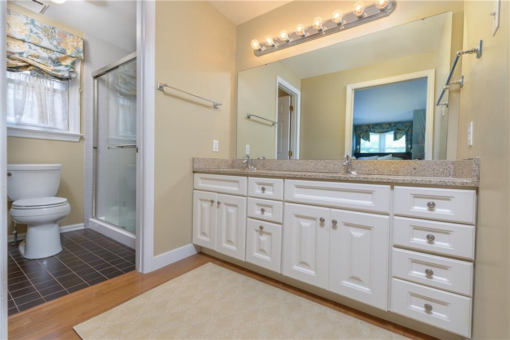 405 Oliver Road Sewickley, PA 15143 - Photo 14 of 25 Master bath has granite double vanity and glass shower.