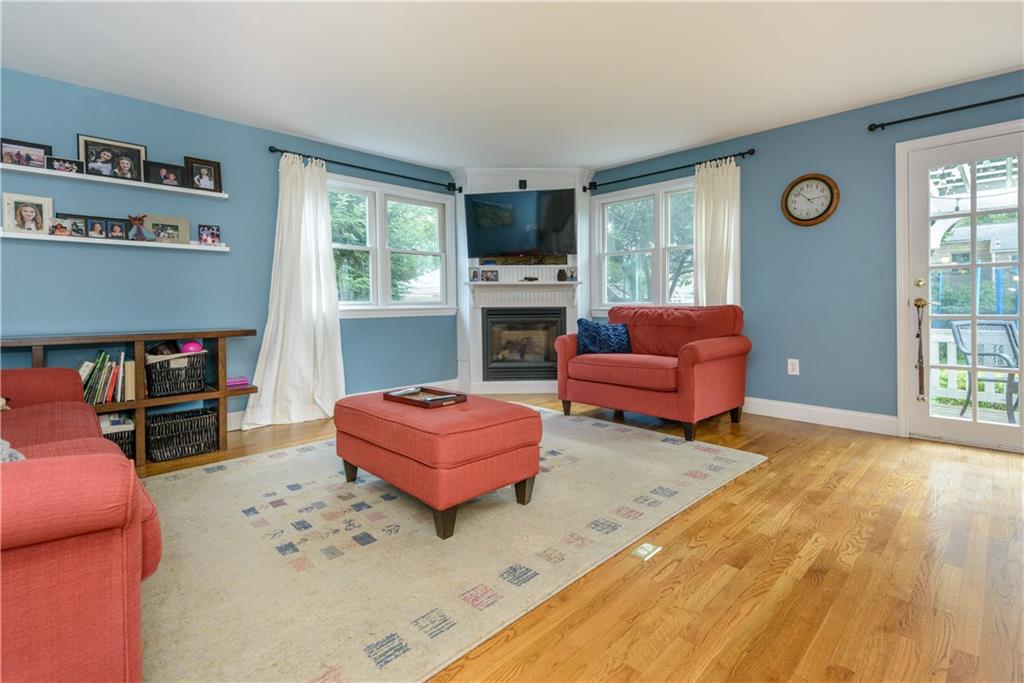 405 Oliver Road Sewickley, PA 15143 - Photo 4 of 25 Large family room with fireplace and walk-out to back deck.