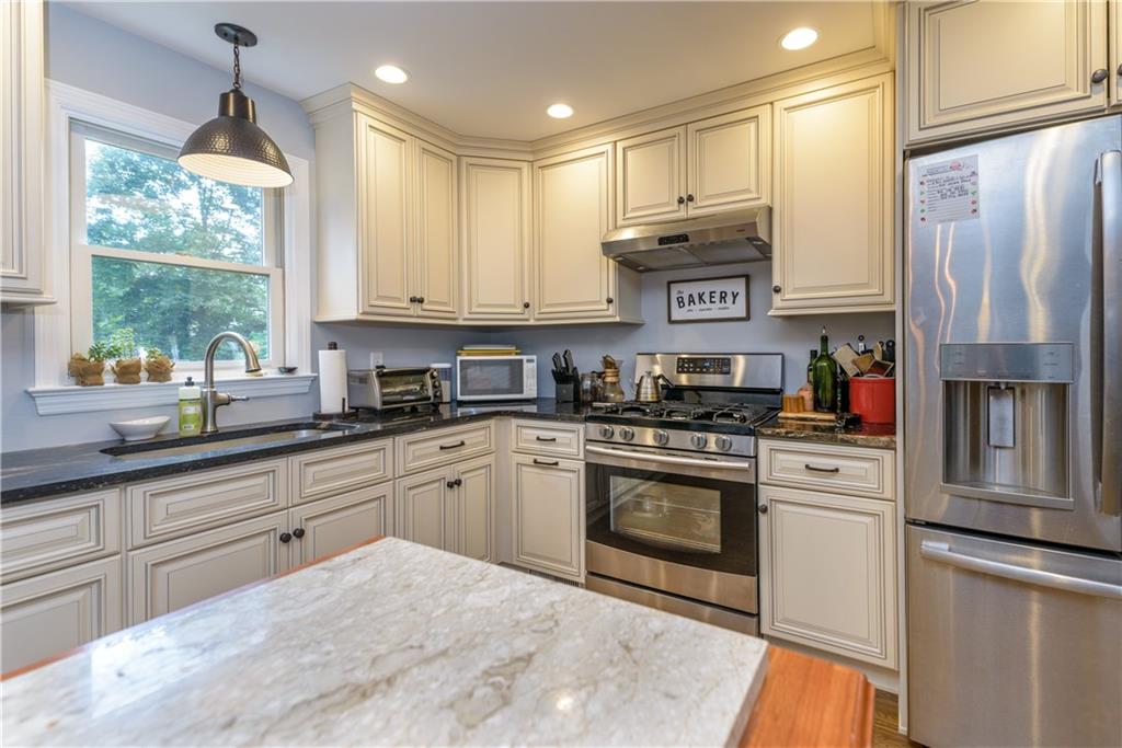 405 Oliver Road Sewickley, PA 15143 - Photo 10 of 25 New glazed white cabinets, stainless appliances with gas range, double convection wall ovens, and granite counters make this a baker's dream.