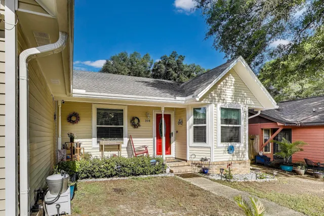 a front view of a house with garden