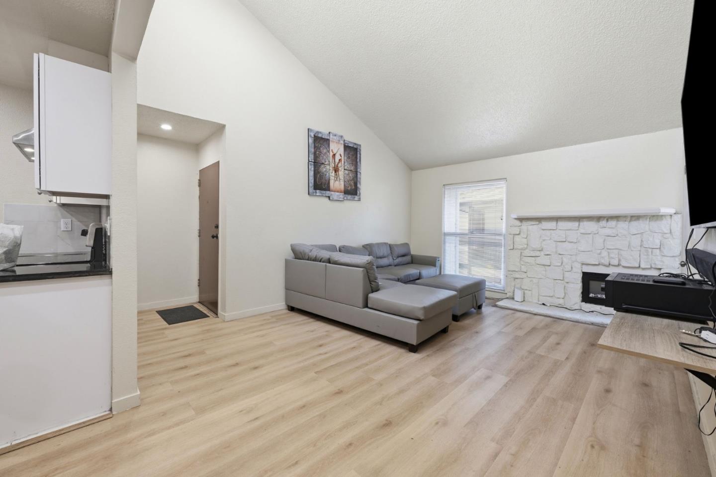 7283 Florin Road, Unit 8 Sacramento, CA 95828 - Photo 10 of 35 a living room with furniture and a fireplace