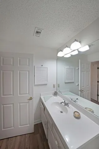 a bathroom with a double vanity sink and mirror
