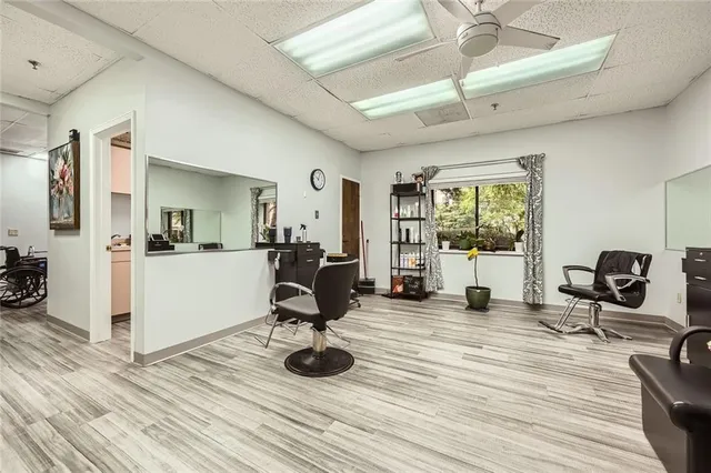a view of a livingroom with furniture and a flat screen tv