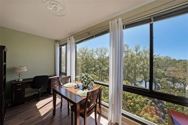 a view of a room with a table and chairs