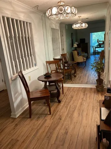 a view of a livingroom with furniture and a floor to ceiling window