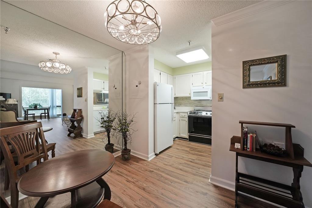 1800 Clairmont Lake, Unit A522 Decatur, GA 30033 - Photo 6 of 36 a kitchen with sink refrigerator and cabinets