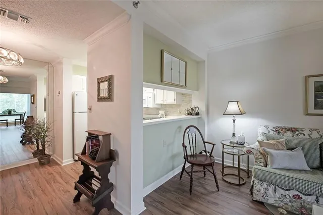 a view of a livingroom with furniture and a workspace