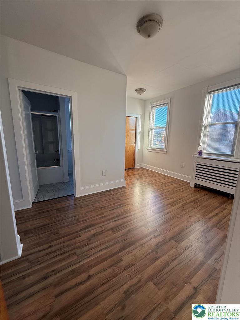 500 Belfast Road Nazareth, PA 18064 - Photo 22 of 36 wooden floor in an empty room with a window
