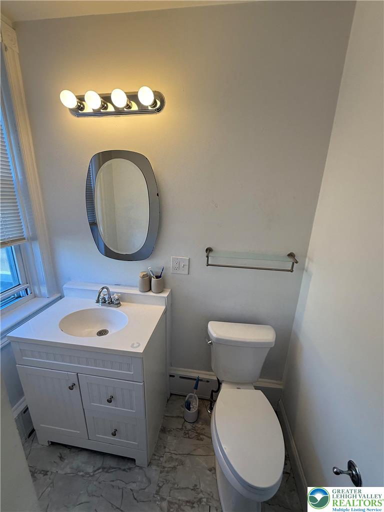 500 Belfast Road Nazareth, PA 18064 - Photo 30 of 36 a bathroom with a toilet sink and mirror
