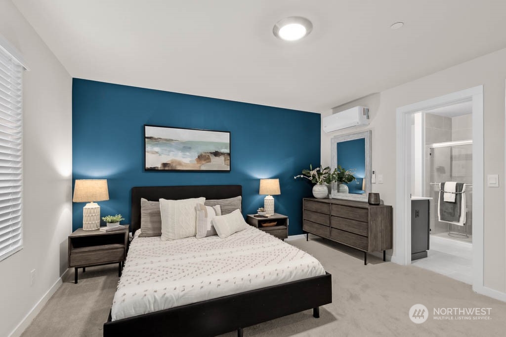 23413 Edmonds Way, Unit E4 Edmonds, WA 98026 - Photo 13 of 22 a bedroom with a bed and a night stand