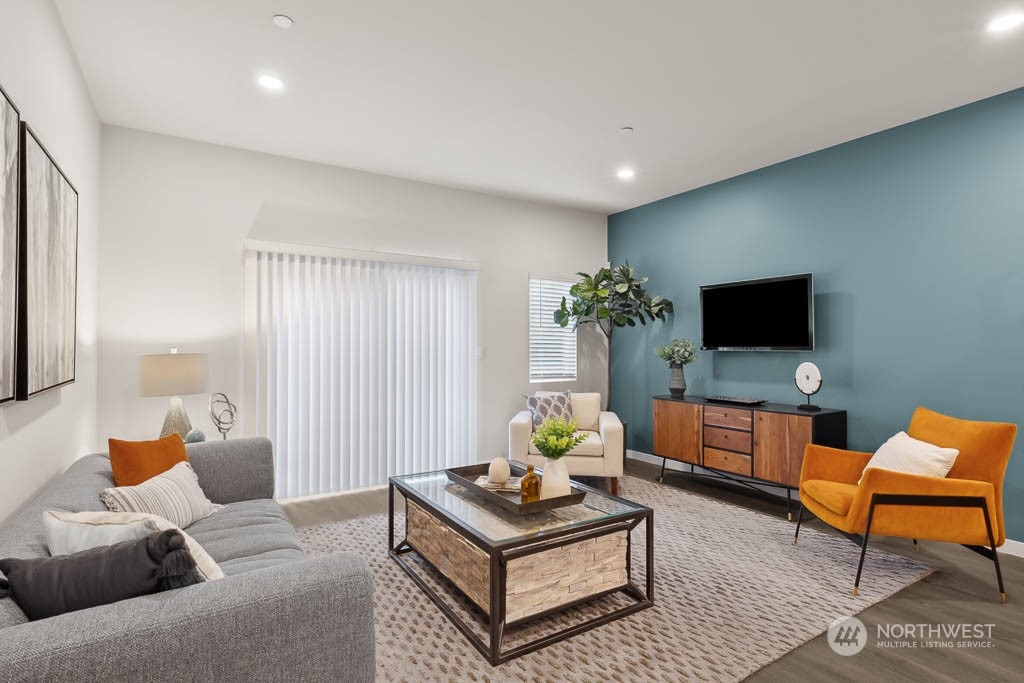 23413 Edmonds Way, Unit E4 Edmonds, WA 98026 - Photo 2 of 22 a living room with furniture and a flat screen tv