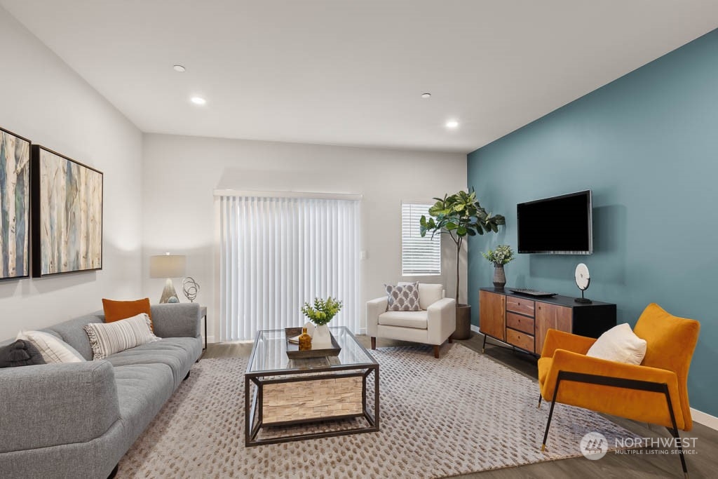 23413 Edmonds Way, Unit E4 Edmonds, WA 98026 - Photo 3 of 22 a living room with furniture and a flat screen tv